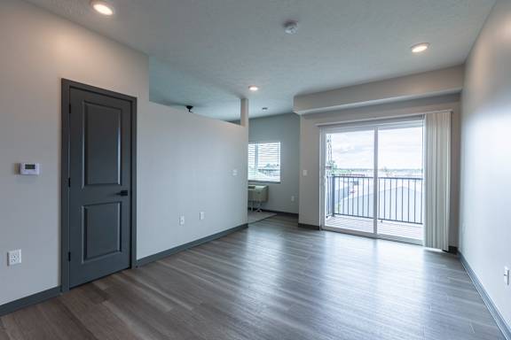 Living area with large windows and open floor plan at The Harbor