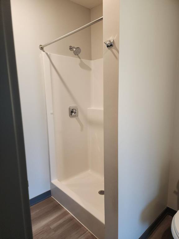 Shower and bathtub combination with curtain rod at The Harbor