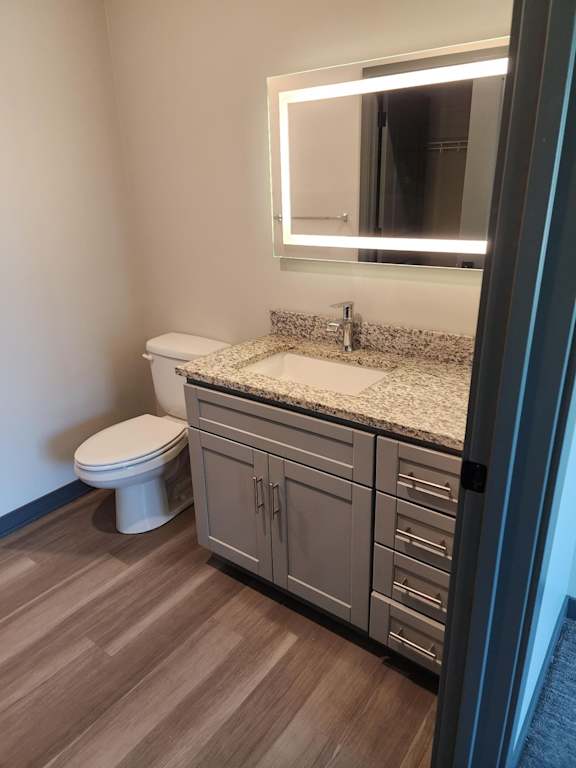 Bathroom vanity with sink mirror and storage cabinet at The Harbor