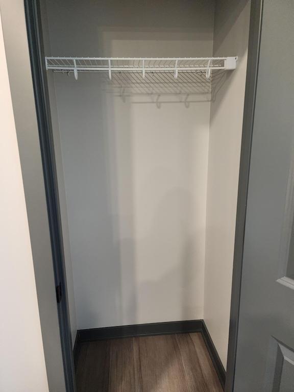 Closet with shelving and open storage space inside the home at The Harbor.