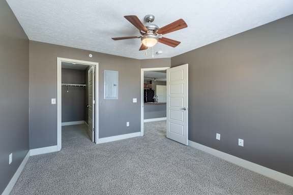 A clubhouse lounge with seating and natural lighting at The Sterling at Grand Island.