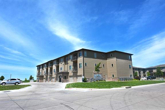 Exterior view of apartment buildings and parking area at The Sterling at Kearney