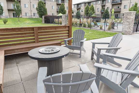 Outdoor swimming pool with surrounding lounge chairs at The Sterling at Kearney