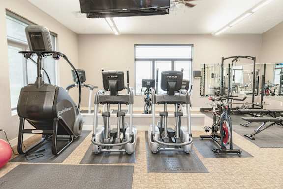 Fitness center with treadmills and exercise equipment at The Sterling at Kearney