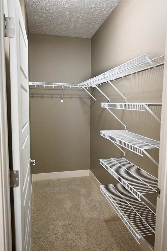 Walk in closet with multiple wire shelves at The Sterling at Kearney