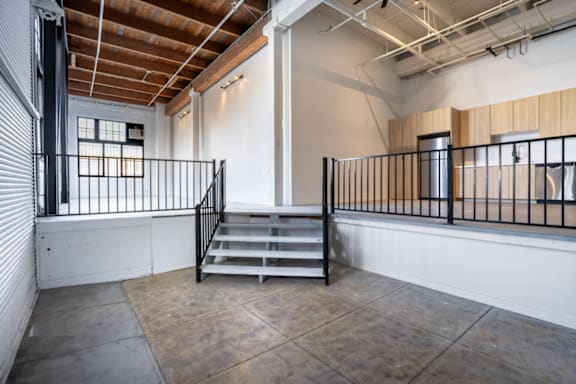 A room with a staircase and a window.