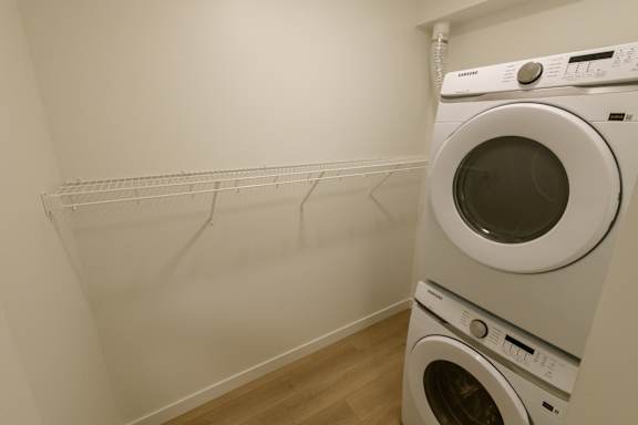 A white dryer is on the right and a white washer is on the left.