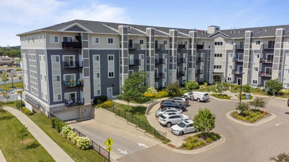 an aerial view of an apartment complex with cars parked in a parking lot at EastGate Apartments, Rochester