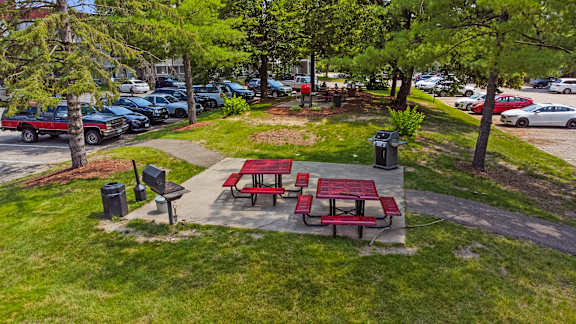 two picnic tables and benches at Heritage Hills Apartments, Bloomington