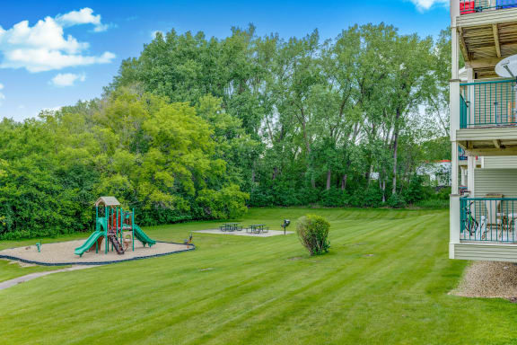 Playground and a picnic area at Pheasant Park Apartments, Minnesota, 55428-5401