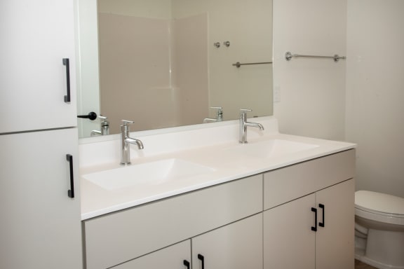 Renovated Bathrooms With Quartz Counters at The Hill Apartments, Saint Paul, MN, 55102