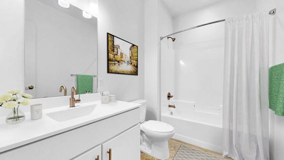 A white bathroom with a toilet, sink, and shower.