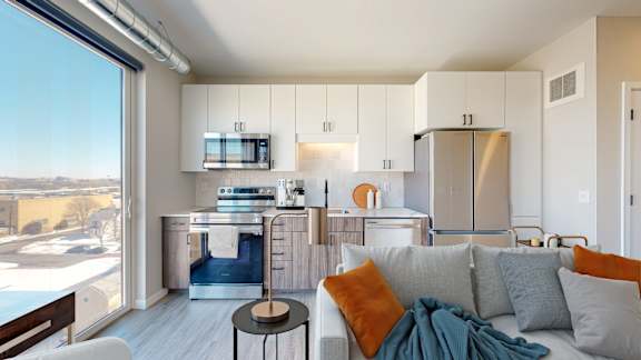 A modern kitchen with a view of the city.