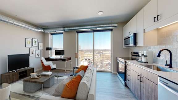 A modern living room with a large window overlooking the city.