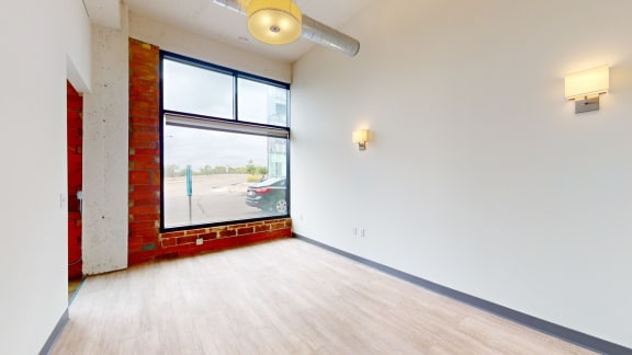 an empty room with a large window