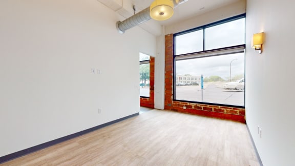 an empty room with a large window