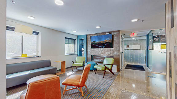 resident lounge with fireplace and tv at Bierman Place, Minneapolis