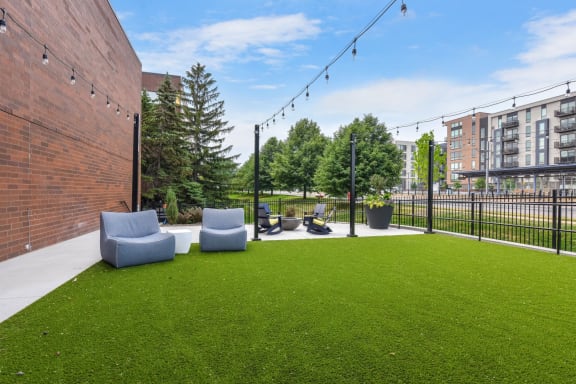 Green Lawn With Patio at AIRE MSP Apartments, Bloomington, 55425