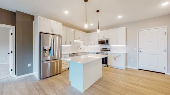 Kitchen Island With Pendent Lights at Arris Apartments - Now Open!, Lakeville, Minnesota