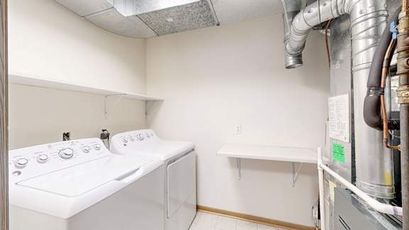 A laundry room with a washer and dryer.