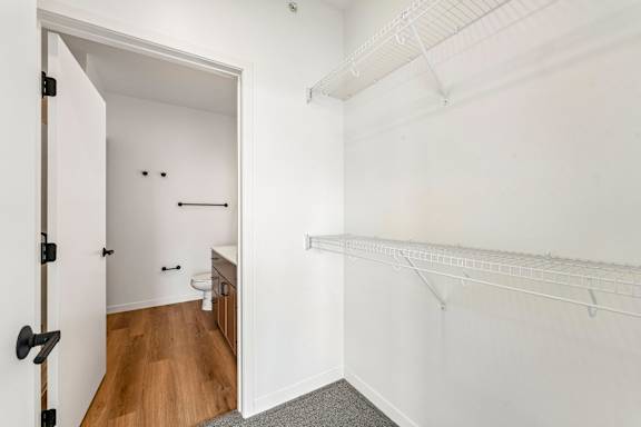 A white room with a toilet and a sink.