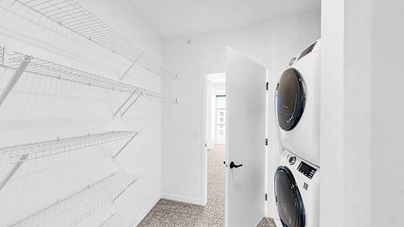 A laundry room with a washer and dryer.