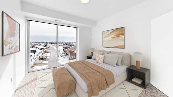 A bedroom with a large bed and a view of the outside.
