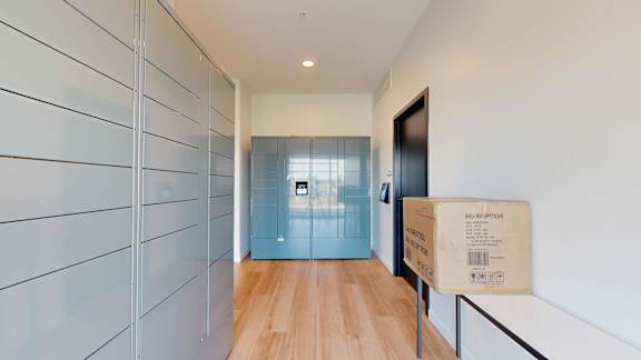 A long hallway with a box on the floor.