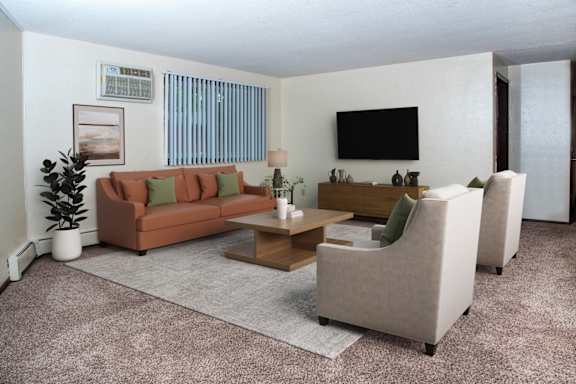 A living room with a couch, chairs, and a television.