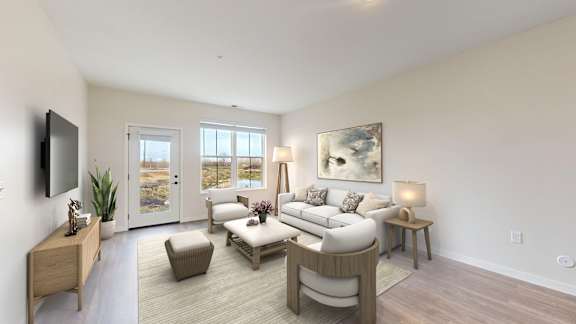 A living room with a couch, chair, and television.