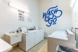 A Wash N Go hair salon with two washing machines.