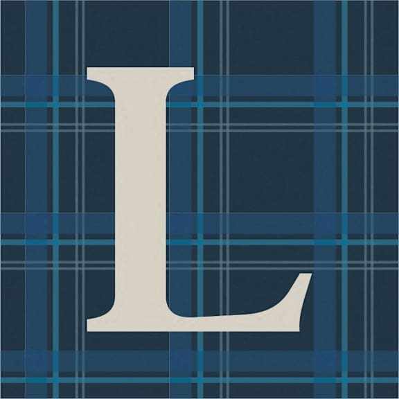 A large white letter L on a blue plaid background at Lochner Apartments, White Bear Lake, MN,  55110