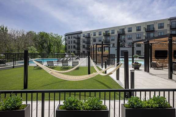 A hammock is strung between two buildings.