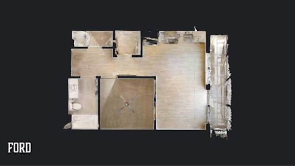 A top down view of a room with a table and chairs.