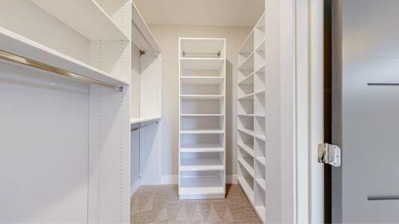 A white staircase with a metal railing is in the center of the image.