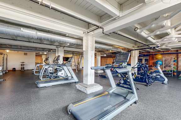 A gym with treadmills and exercise equipment.