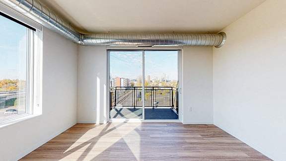 sliding glass door at The Bessemer at Seward Commons Apartments, Minnesota, 55404
