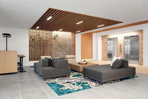A modern living room with a wooden ceiling and grey couches.at Viridium Apartments, Minnesota
