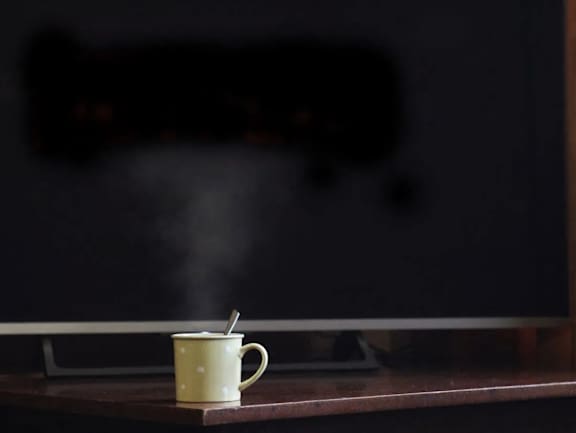 A cup of hot beverage with steam rising from it at The Redwell Apartments, Minnesota 55401