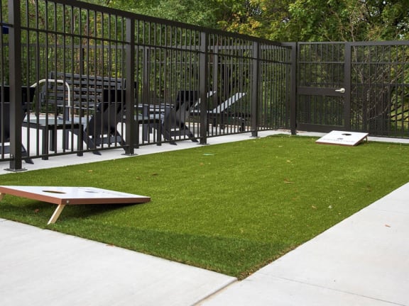 UPII corn hole games on patio at Urban Park I and II Apartments, St Louis Park, Minnesota