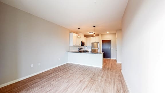 a kitchen and dining area in a 555 waverly unit
