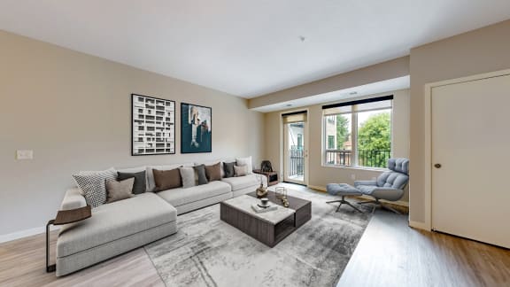 an open living room with a couch and a coffee table