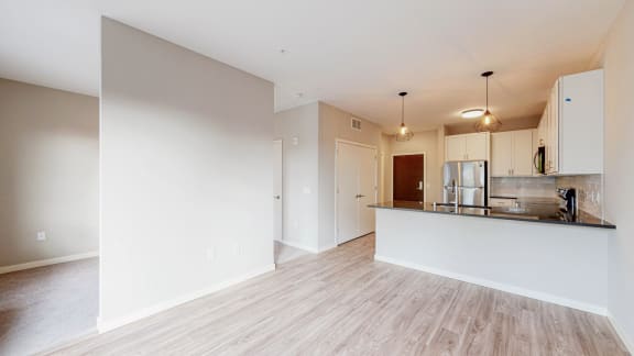 a kitchen and dining area in a 555 waverly unit