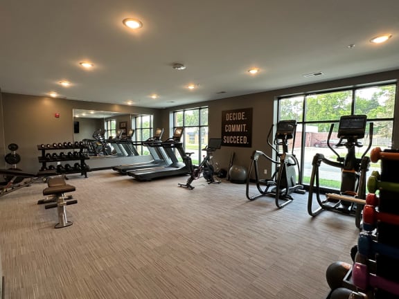a gym with cardio equipment at The Exchange Apartments, New Brighton, 55112