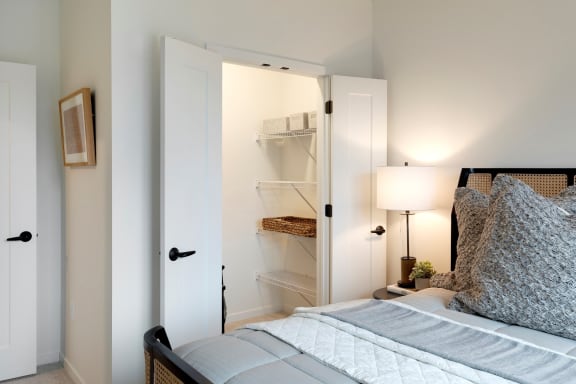 Bedroom with Spacious Closet Space and Lighting  at The Hill Apartments, Saint Paul