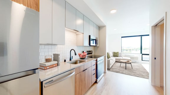 a kitchen with stainless steel appliances and a sink