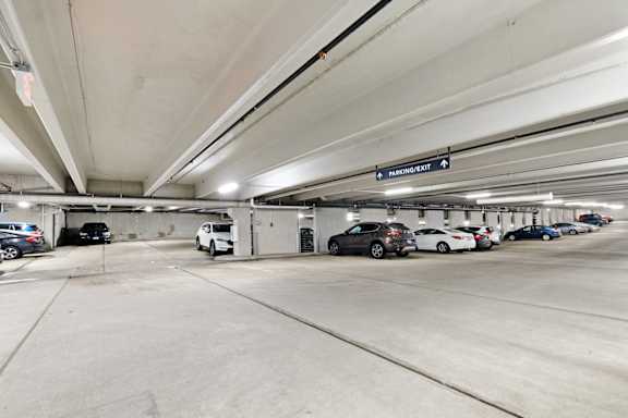 A parking garage with a sign that reads "MERCHANDISE" is shown.