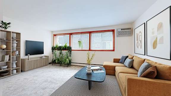 A living room with a brown couch, a black coffee table, and a red window.