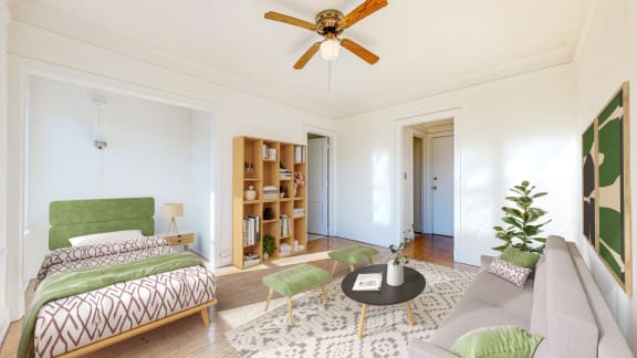 a bedroom with a bed and a ceiling fan