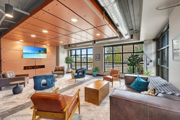 a large living room with furniture and large windows